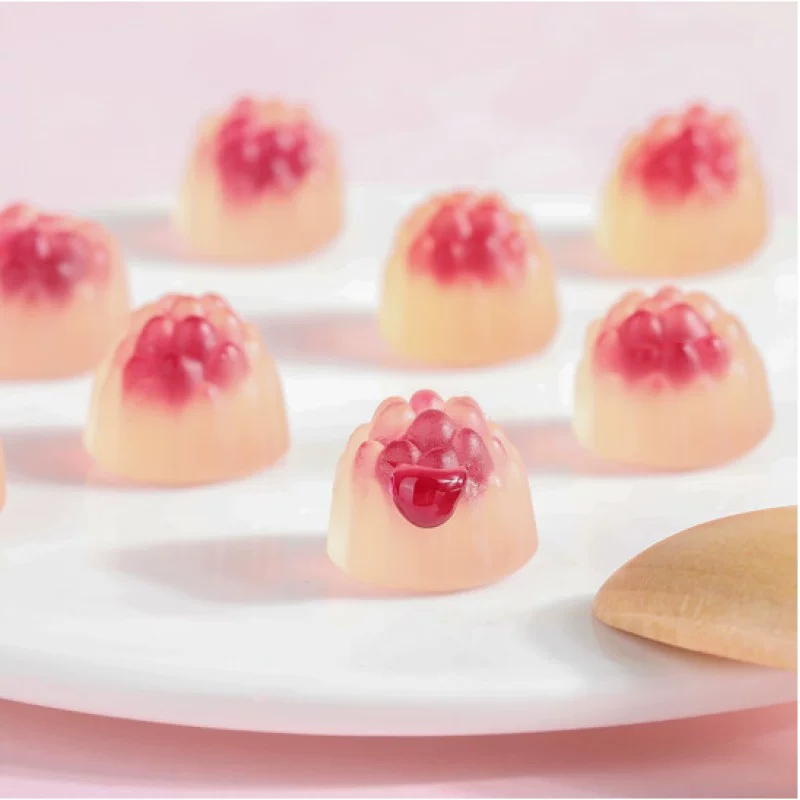 Fruit-filled gummy candy with raspberry center cross-section view
